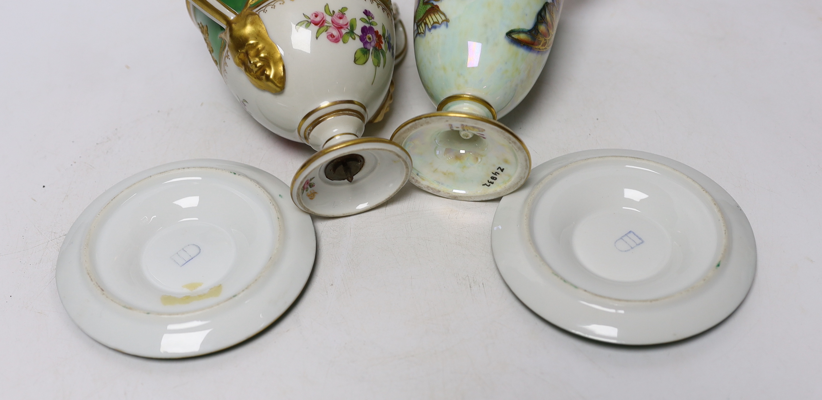A Continental porcelain twin handled trophy cup with landscape vignettes, together with a pair of Continental liqueur cups and dishes, and a Wedgwood butterfly lustre posy vase, design number Z4832, vase 13.5cm high (4)